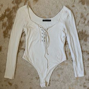 Naked wardrobe off white lace up body suit